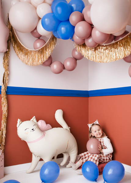 balloon decor, inflated balloons, cat plush, girl in party, balloon animals
